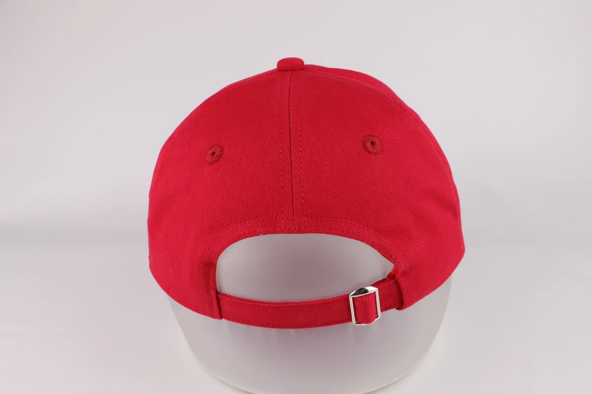 Back of red casual cap with red adjustable fabric strap and silver metal slider